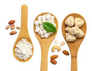 Trio of wooden spoons holding nuts, white pills, and textured blocks on black, close-up and overhead shot