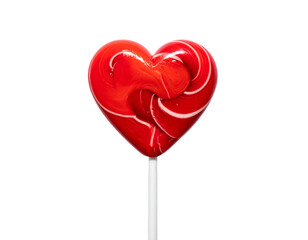 Vibrant red, heart-shaped lollipop with a white swirl detail and white stick against stark black background