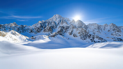 Snowy mountain peaks glisten under bright sunlight, creating serene winter landscape
