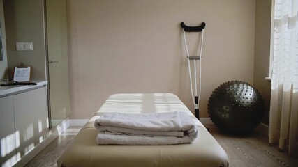 Recovery and rehabilitation treatment with equipment, crutches, and exercise ball, perfect for physical therapy or wellness center promotion