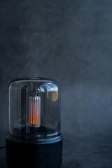 Close up of home perfume scent air humidifier with light. Aromatherapy holistic health practices concept. Stress relief activities preparing for meditation. Simple pleasures healing habits