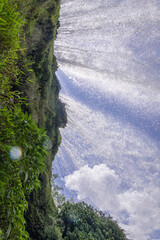 Water falling from the cliffs under Magnificent Huangguoshu Grand Waterfall in Guizhou China, background, copy space