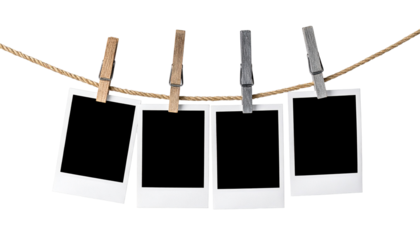 Four Instant Photo Frames Hanging on Rope isolated on white and transparent