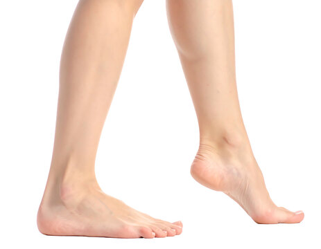 Woman's bare legs and feet walking, isolated on a transparent background, showcasing skin tone and foot arches