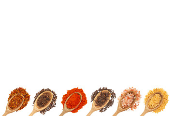Spoons with spices at the bottom on white background