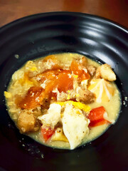 Authentic Indonesian Street Food Seblak with Orange Broth and Mixed Savory Ingredients