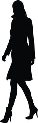 Silhouette of Elegant Woman in Long Coat and High Heels Walking
