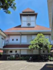 blurry photo of the Catholic church complex during the day
