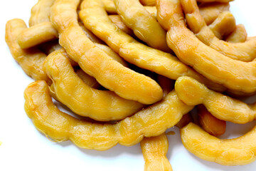 Sweet preserved tamarinds on white background.