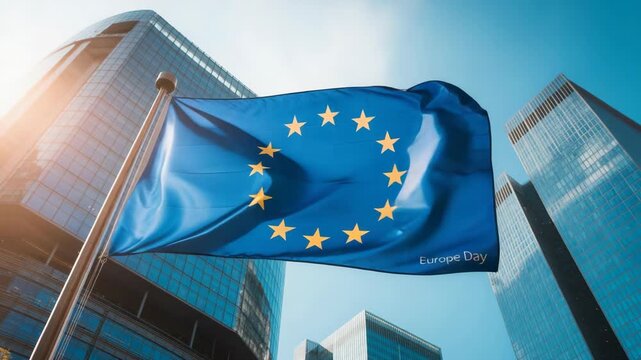 European union flag waving in front of modern buildings daytime