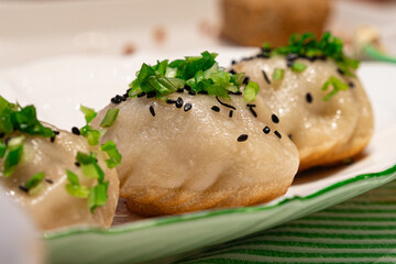 A plate of pan-fried Chinese buns