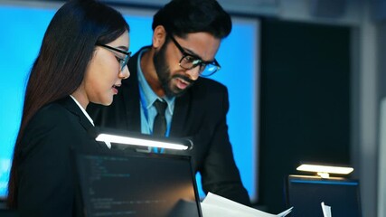 Diverse team of IT and business professionals focused on data analysis and technology in a secure, blue-lit control room environment. Excellent for concepts of corporate security and digital work. - Powered by Adobe