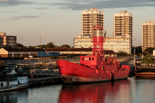 Red lightship lv 21 moored in urban harbor