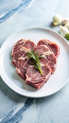 Fototapeta premium Raw pork heart cut into thin slices on a white plate