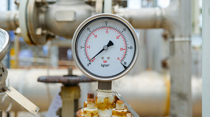 A pressure gauge installed on a chemical pipeline measures internal pressure, ensuring safety, accuracy,