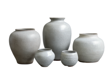 Ceramic vases group of gray textured handmade pottery on dark backdrop