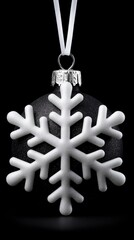 Elegant Black Christmas Ornament with White Snowflake on a Dark Background