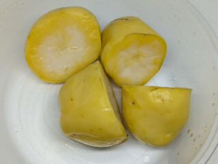 Freshly Prepared Yellow Potatoes in Segments Ready for Cooking