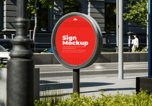 Large Circular Sign Mockup on a Metal Post Against a Busy Urban Background