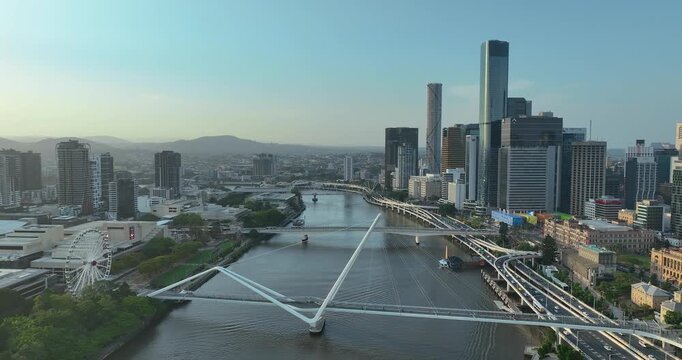 4K Aerial Locked off stationary motion of west side Brisbane CBD, known as South Bank Precinct with new buildings and new pedestrian bridge called Neville Bonner Bridge, Brisbane, QLD, Australia