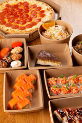 Pizza, rolls, and pasta ready for delivery.