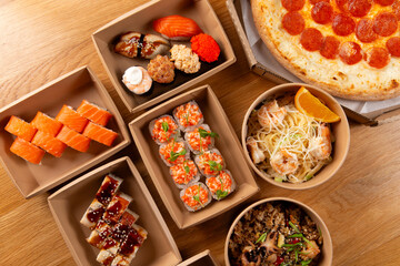 Pizza, rolls, and pasta ready for delivery.