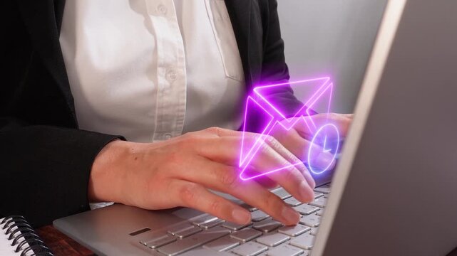 Pending message reminder. Close-up of a businesswoman working on her computer with a virtual icon of a mail envelope with a clock.