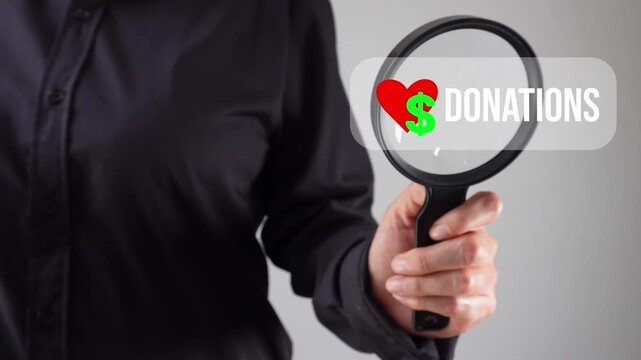 A woman with a magnifying glass analyzing an animation of a donation button with a heart and a money sign