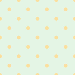 A seamless pattern featuring soft orange polka dots perfectly aligned in a grid on a light mint green background. This minimalist design is perfect as a background, digital paper or textile print.