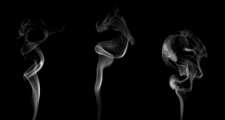 Set of abstract white smoke shapes rising on black background, creating soft swirl motion. Perfect for design, vapor, mystery, meditation, or energy concept visuals.