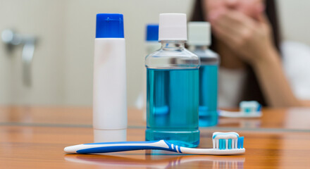 Oral Hygiene Essentials: Toothbrush, Toothpaste, and Mouthwash on a Bathroom Counter