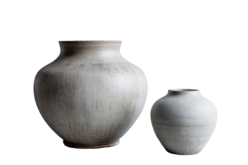 Two clay vases, off-white and gray tones, on a solid dark backdrop