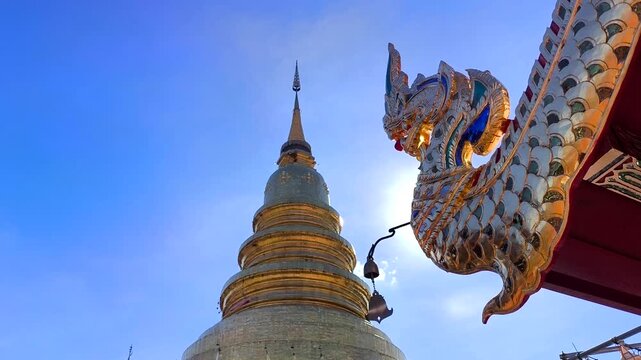 Pagoda and Naga statue in Wat Hariphunchai, Lumphun province Thailand.