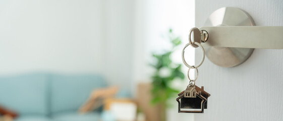 Moving house, relocation. The key was inserted into the door of the new house, inside the room was...