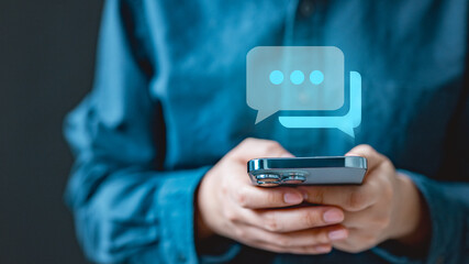 message, chat, messaging, texting, online, A person using smartphone to send and receive online messages, showing digital chat bubbles representing communication, connection, and social interaction.