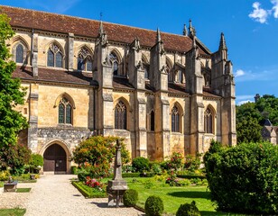 Fototapeta premium European gothic-style building with gardens and arched windows