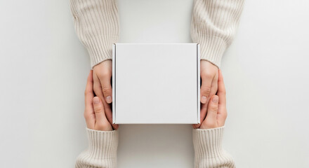 Blank White Box Held by Hands, Minimalist Product Packaging Mockup on Clean Background for Design