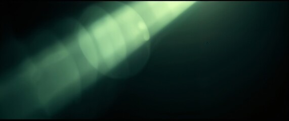 Abstract green light lens flare simulating bokeh effect