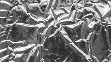 Shiny metal silver gray foil leaf crumpled texture background
