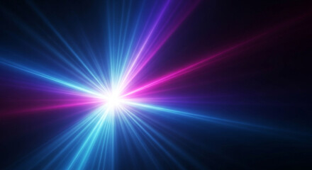 Fototapeta premium Exploding starburst effect with vibrant blue and magenta light rays bursting from a bright white core against a dark background, perfect for futuristic concepts.
