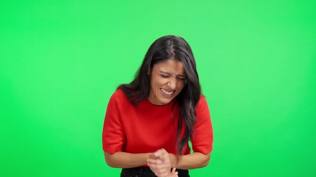Hilarious hispanic woman laughing out loud in slow motion