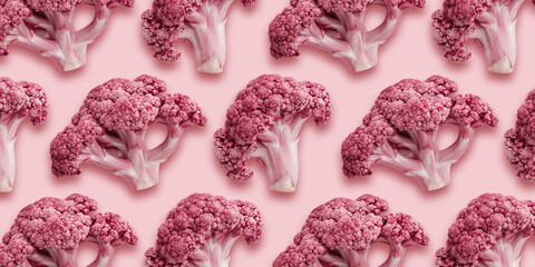 Fresh colored cauliflower florets as minimal creative pattern on pastel pink. Vivid vegetable healthy organic food banner. Trend Flat lay composition for modern design, healthy lifestyle, food photo