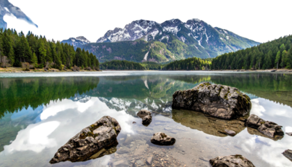 Serene mountain lake scene with forest and snow-capped peaks