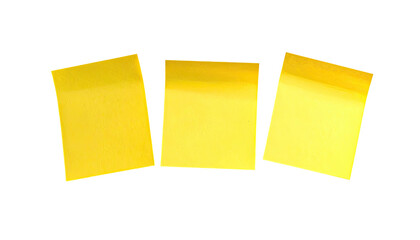 Three yellow sticky notes isolated on a stark black background