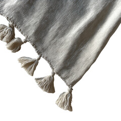 Textured beige fabric corner with fluffy tassels