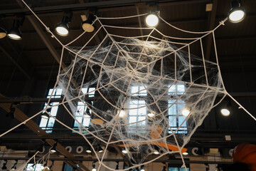 Big Spider Web Halloween Decoration with illuminations on ceiling