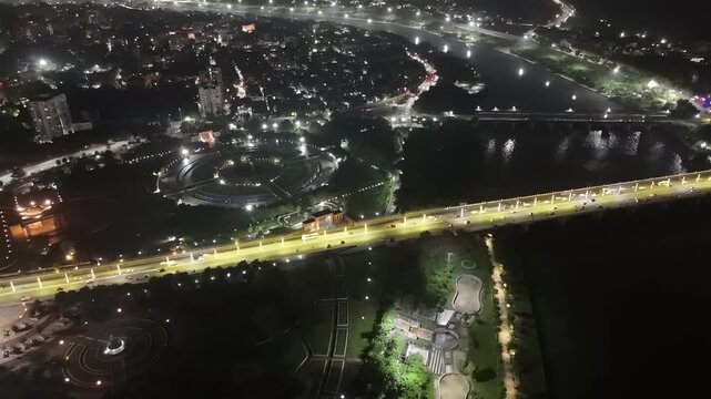 Aerial night view of Gomti River bridge traffic in Lucknow, Uttar Pradesh, India