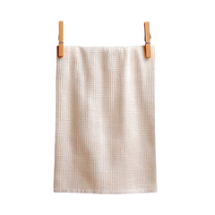 Linen cloth hangs via two wooden clothespins against black
