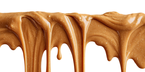 Drips of smooth, golden-brown creamy caramel or fudge against black