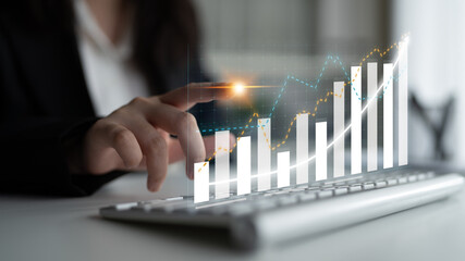 Business professional engages with digital financial growth data through innovative graphs,...